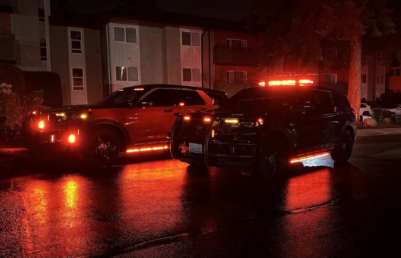Two Falcon patrol SUVs with their lights on at night
